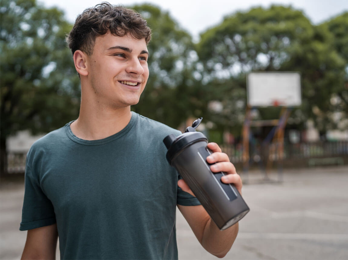 teenager with a protein shake